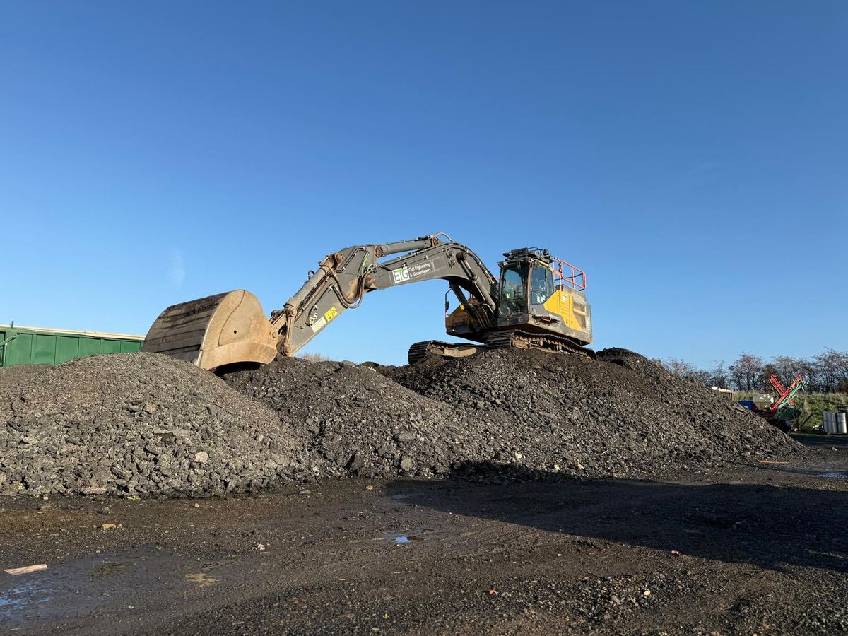 Volvo excavator working on a concrete removal site